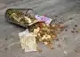 Coins and Banknotes Scattered on Gray Wooden Surface